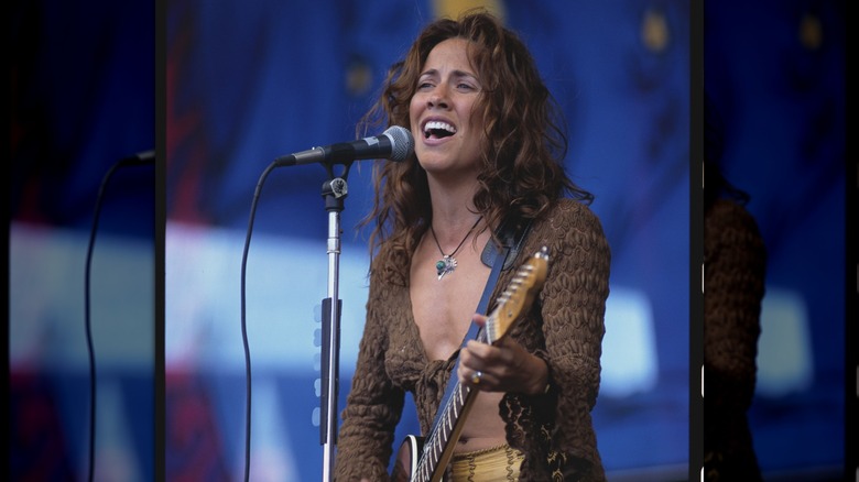 Sheryl Crow singing onstage