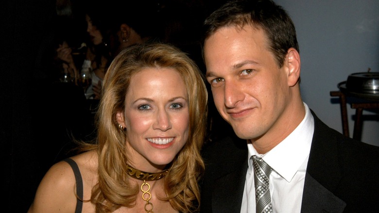 Josh Charles and Sheryl Crow smiling at an event