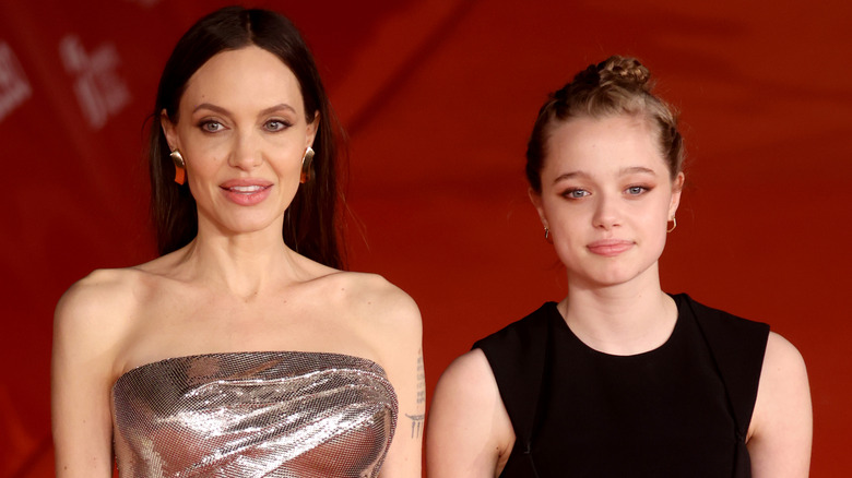Shiloh Jolie-Pitt posing for photos with her mom Angelina Jolie