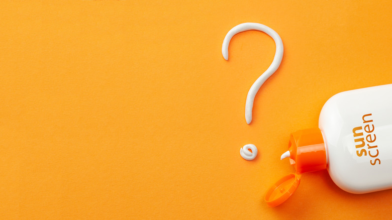 sun screen on orange background with question mark