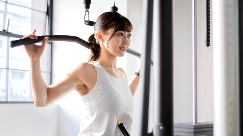 Performing a back lat pulldown