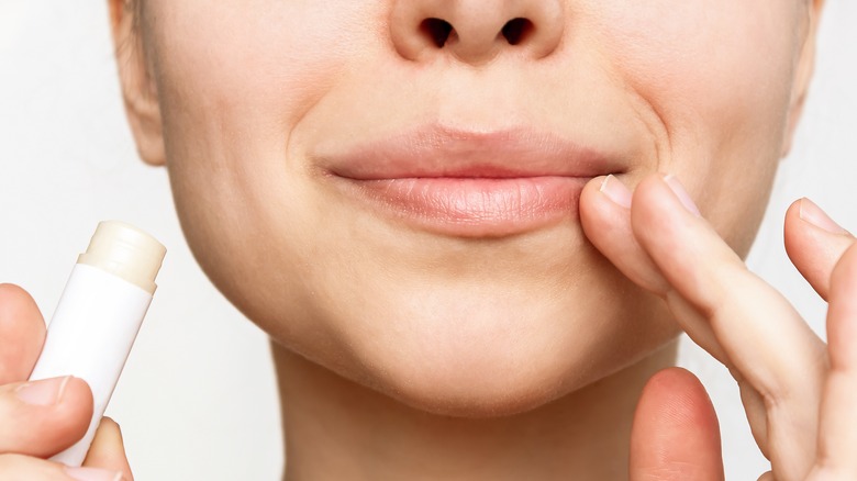 applying lip balm