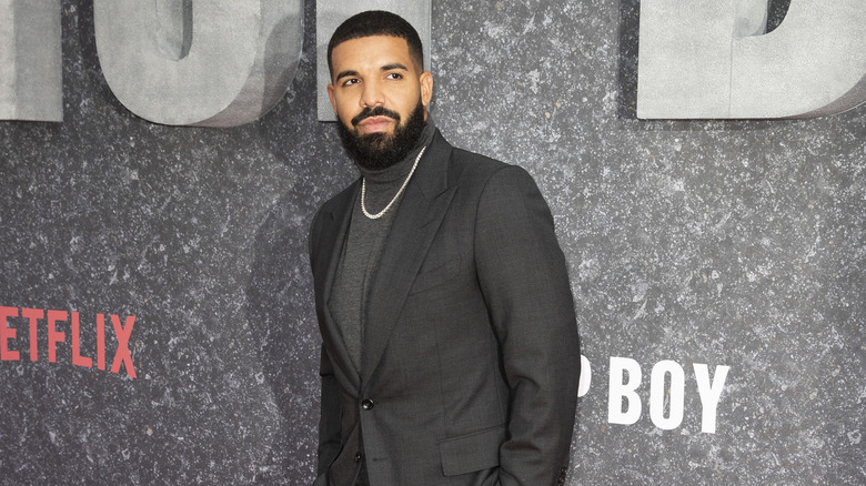 Drake posing at event