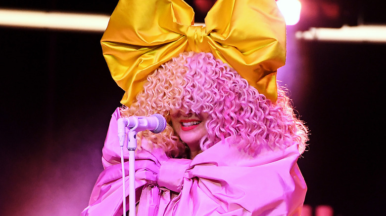Sia on stage with wig