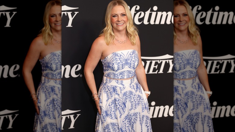 Side-by-side of Melissa Joan Hart wearing Black in the early '90s and pink in 2025