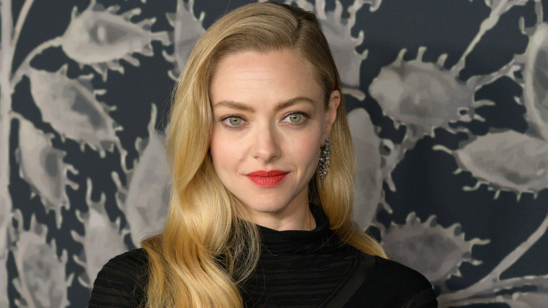 image of Amanda Seyfried smiling and staring fixedly at something offscreen