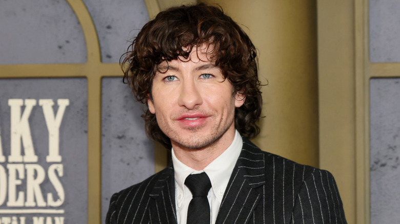 Barry Keoghan in a black tuxedo with white stripes