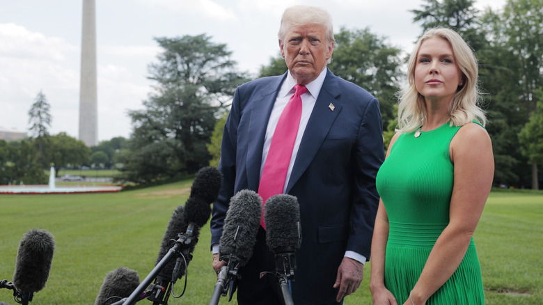 Karoline Leavitt and Donald Trump standing side-by-side during a press gaggle