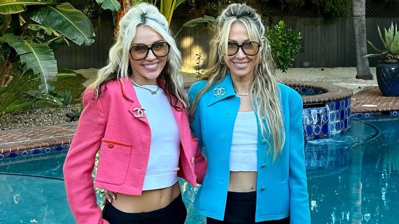 Miley Cyrus and Tisk Cyrus smiling together