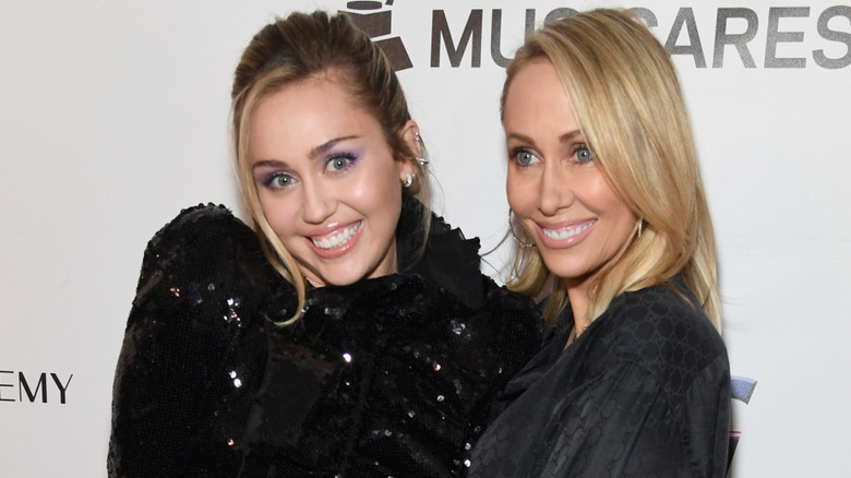 Miley Cyrus and Tish Cyrus smiling together