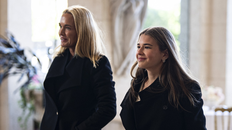 Vanessa Trump and Kai Trump in black trenchcoats