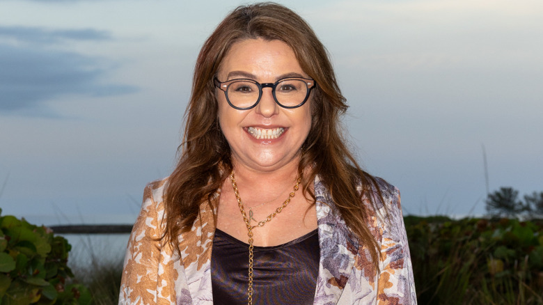 Rachael Ray wearing glasses and a floral blazer.