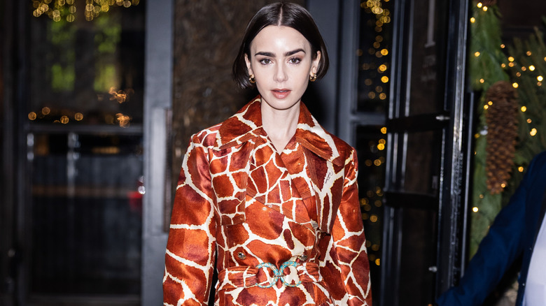 Lily Collins looking impeccable walking down a street