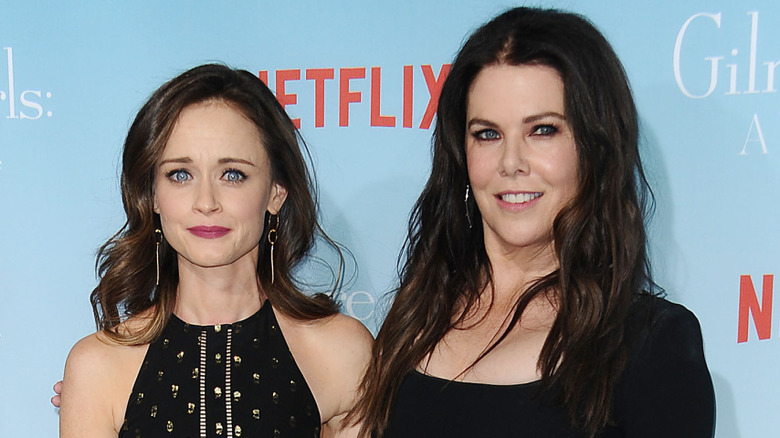 Alexis Bledel and Lauren Graham in black dresses at a red carpet event