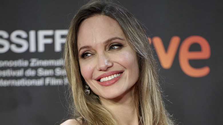 Angelina Jolie smiling with straight hair