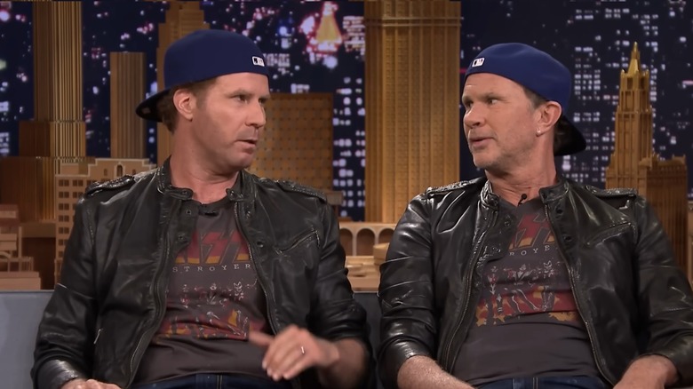 Will Ferrell and Chad Smith in matching outfits looking at each other on The Tonight Show with Jimmy Fallon