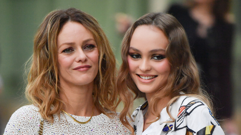Vanessa Paradis and Lily-Rose Depp outdoors at the Chanel Cruise Collection 2020 with their hair styled in similar loose waves.