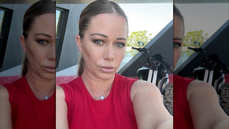 Kendra Wilkinson selfie in a red top.