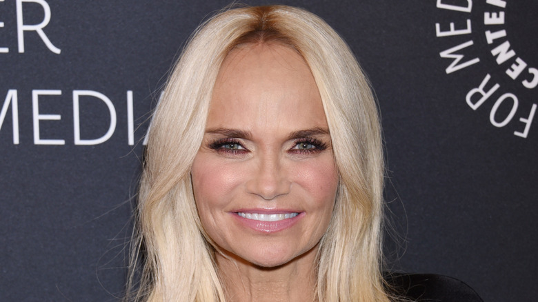 Kristin Chenoweth smiling for the camera on the red carpet of an event