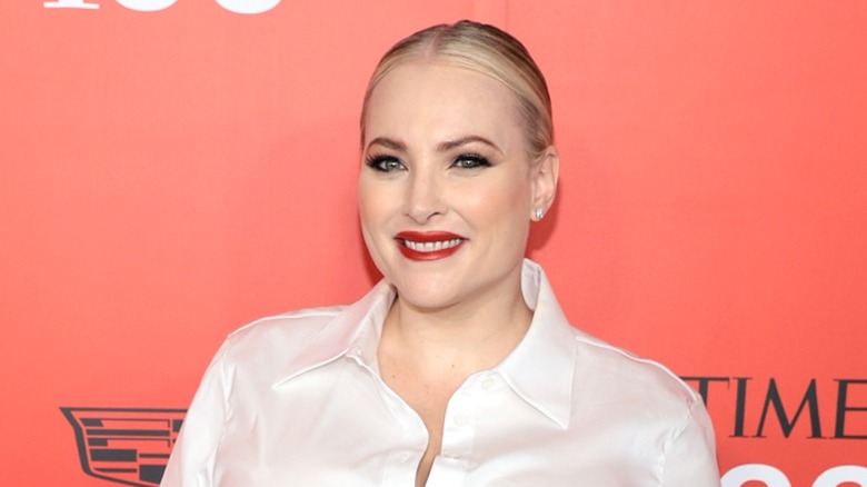 Meghan McCain in a white blouse.