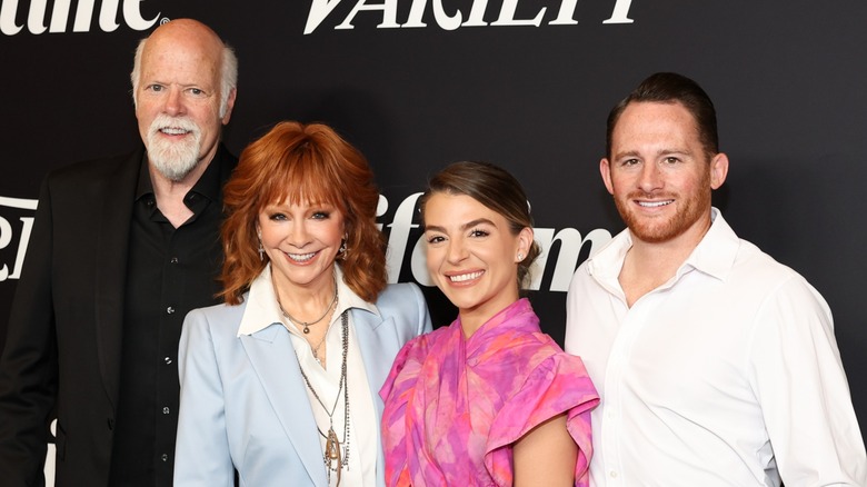 Rex Linn, Reba McEntire posing and smiling with Marissa Blastock and Shelby Blackstock.