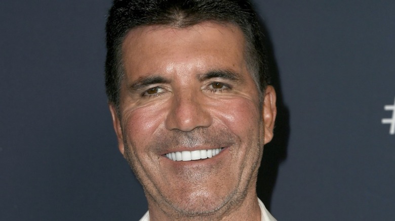 Simon Cowell smiling with ultra-bright white veneers