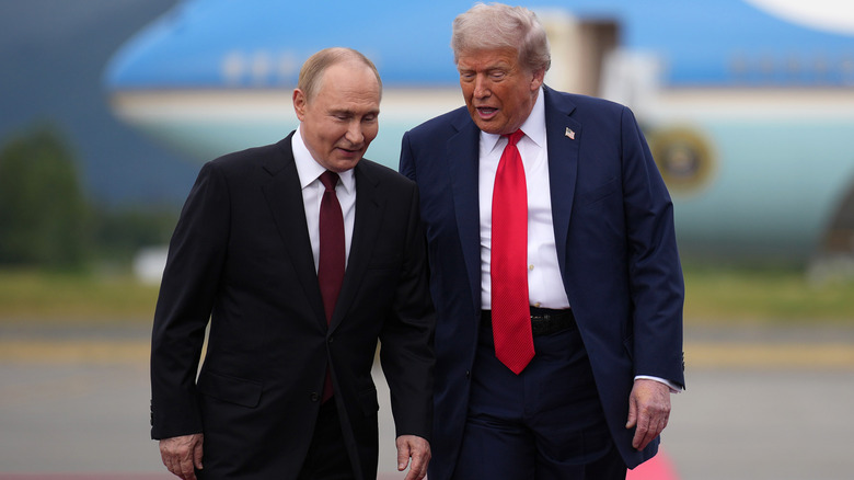 U.S. President Donald Trump (R) walks with Russian President Vladimir Putin as they arrives at Joint Base Elmendorf-Richardson on August 15, 2025 in Anchorage, Alaska (2025)