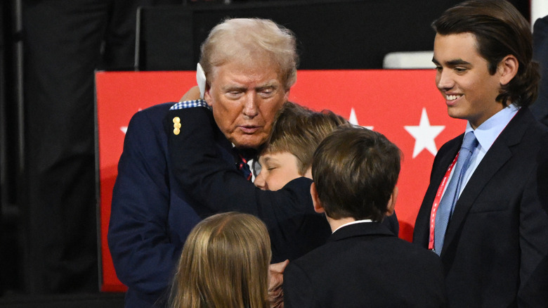 Donald Trump hugs his grandson Tristan Trump on the third day of the Republican National Convention at the Fiserv Forum on July 17, 2024 in Milwaukee, Wisconsin (2024)