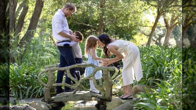 Sussex family in the woods on a bridge