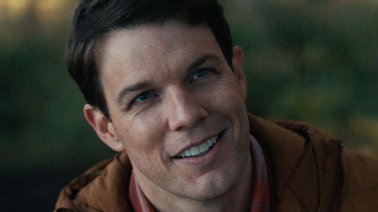 Jake Lacy smiling in Significant Other