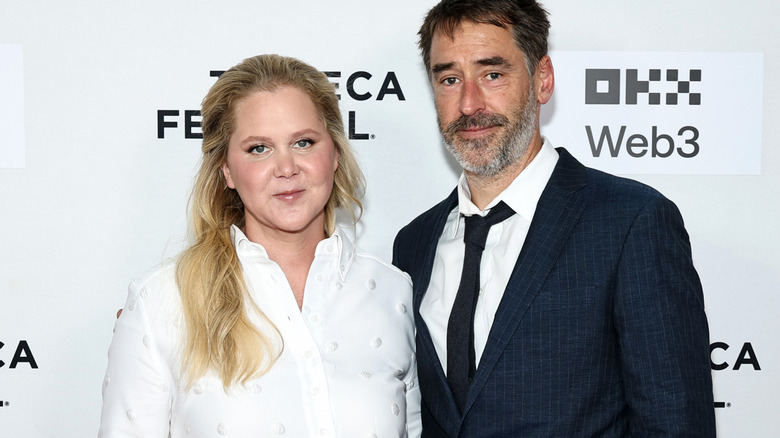 Amy Schumer and Chris Fischer posing