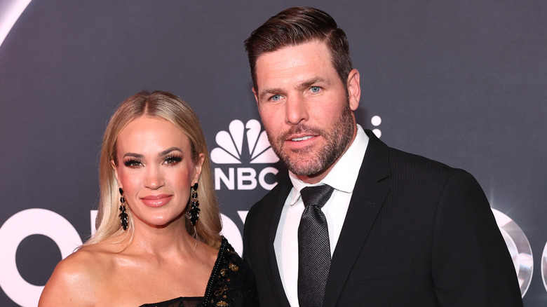 Carrie Underwood and Mike Fisher attend NBC's Opry 100: A Live Celebration at The Grand Ole Opry in Nashville in March 2025