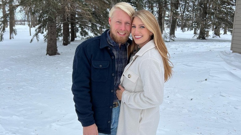 Ethan and Olivia Plath smiling in snow