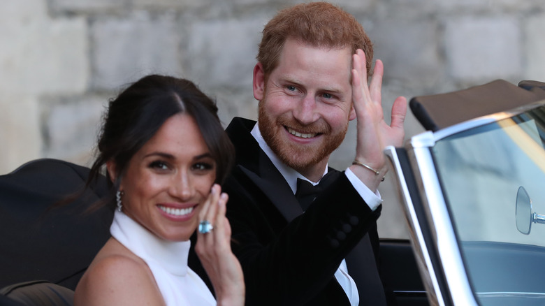 Meghan Markle and Prince Harry waving