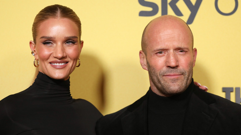 Jason Statham and Rosie Huntington-Whiteley posing for photos
