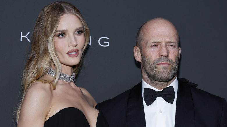 Jason Statham and Rosie Huntington-Whiteley posing for photos