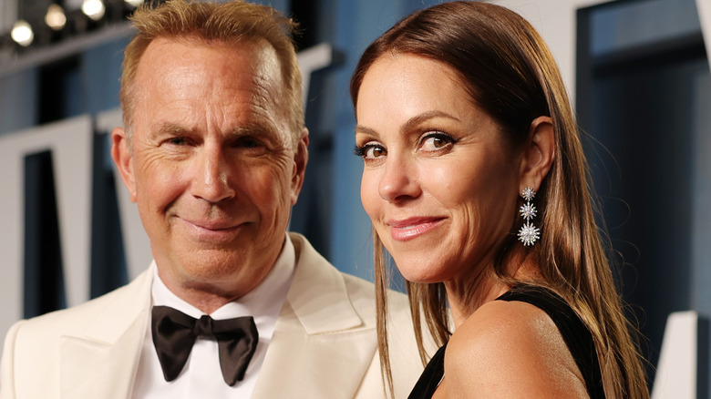 Kevin Costner and Christine Baumgartner smiling