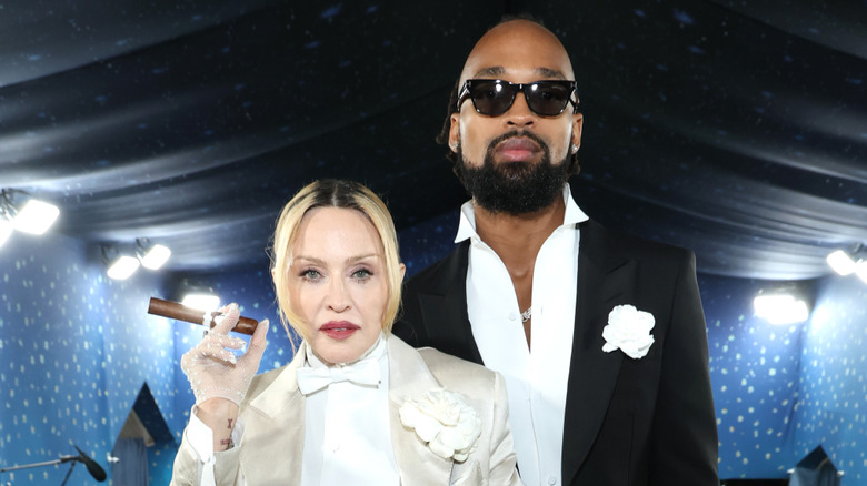 Madonna and Akeem Morris posing for photos at the 2025 Met Gala