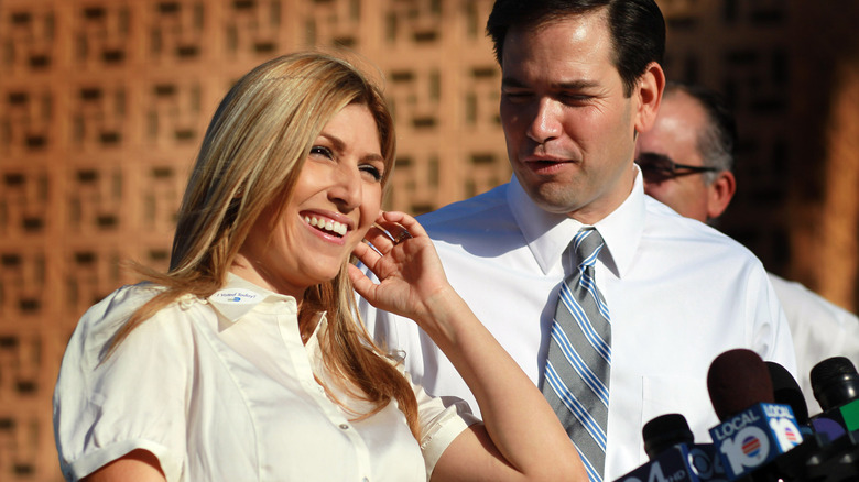 Marco Rubio looking adoringly at Jeanette Rubio as she speaks to reporters