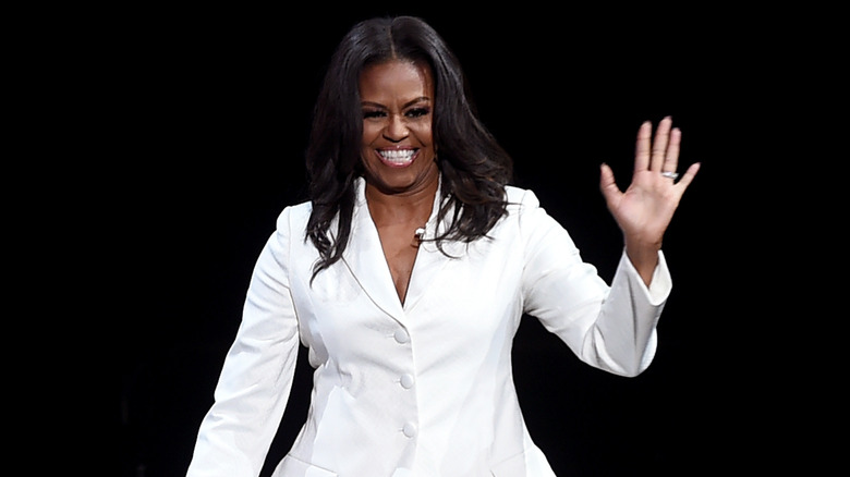Michelle Obama smiling onstage
