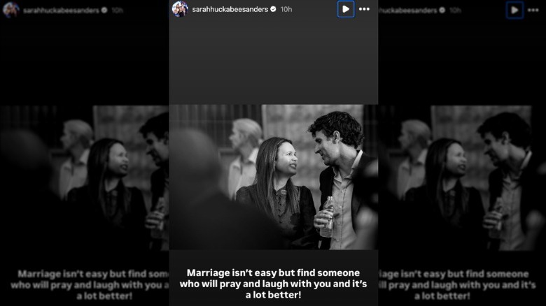 Sarah Huckabee Sanders smiling at her husband Bryan Sanders in a black and white photo.