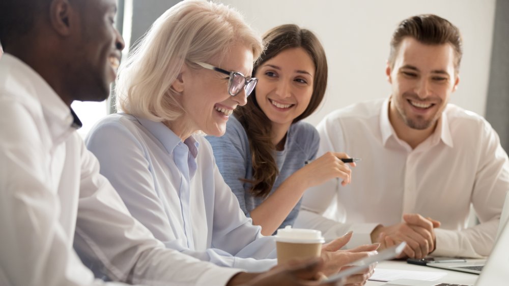 woman boss with colleagues