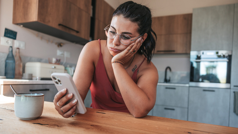 woman waiting for a text