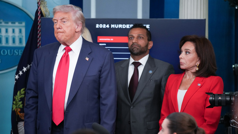 Donald Trump with Kash Patel and Jeanine Pirro behind him in the White House Press Room