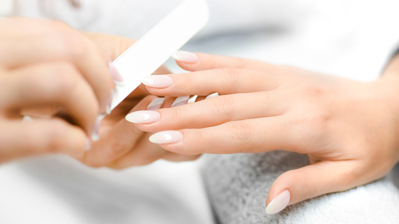 Hands getting a manicure