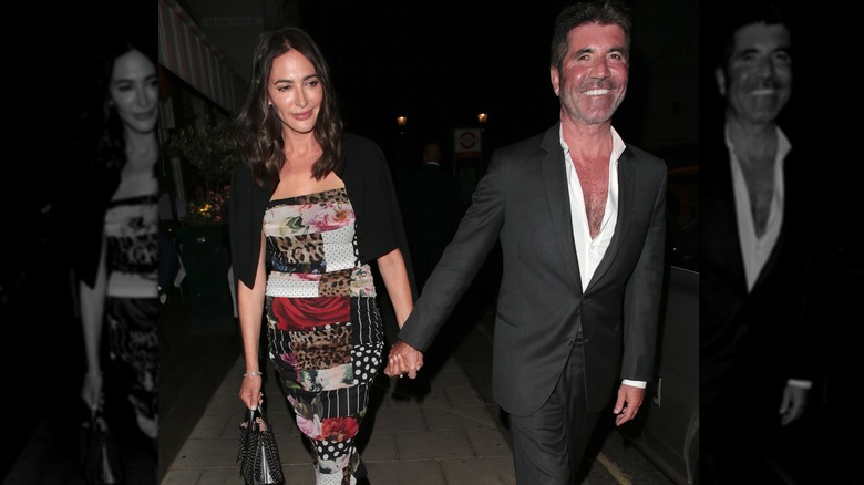 Lauren Silverman and Simon Cowell holding hands while walking on a date