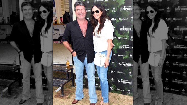 Simon Cowell and Lauren Silverman smile for a photo at Hyde Park