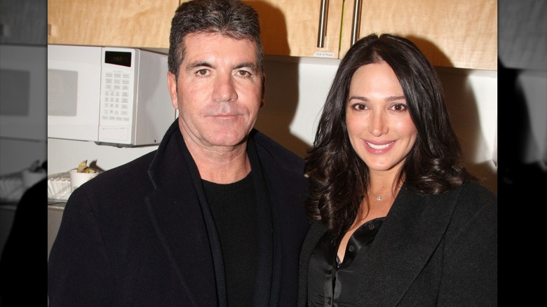 Simon Cowell and Lauren Silverman pose backstage at "Beautiful: The Carole King Musical" on Broadway