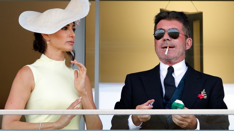 Lauren Silverman and Simon Cowell watch the race at the Royal Ascot