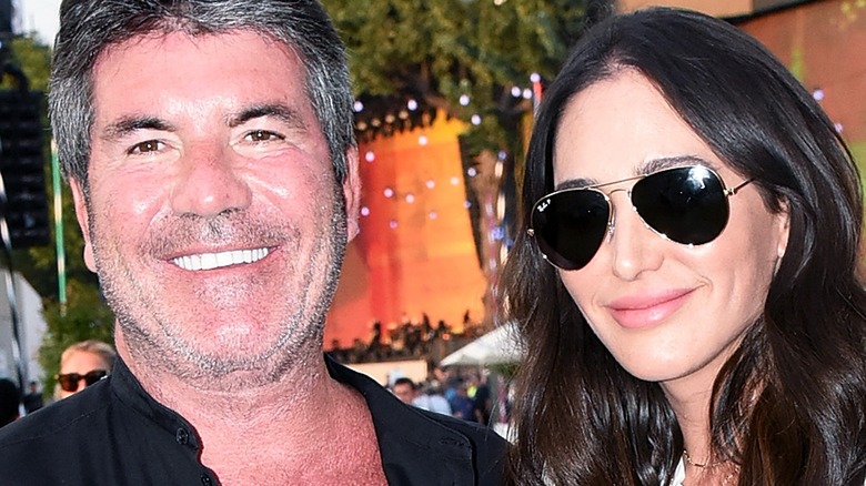 Close-up of Simon Cowell and Lauren Silverman smiling